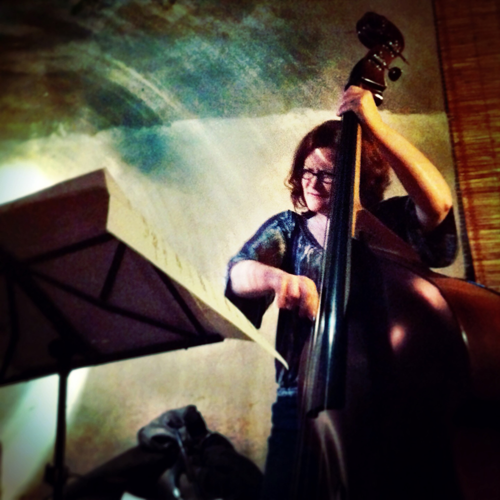 A person playing an upright bass.
