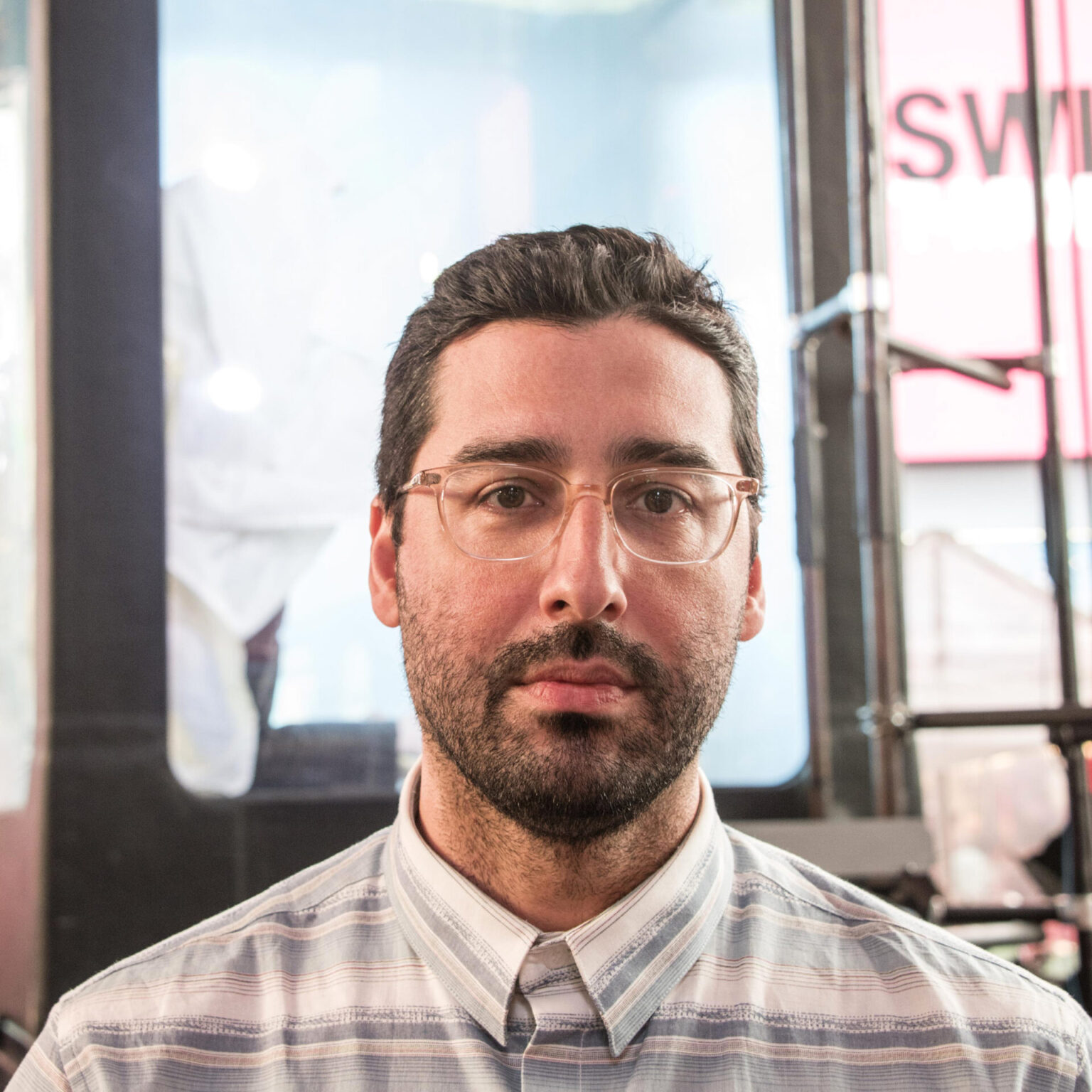 Lars Jan wearing glasses and a button up shirt