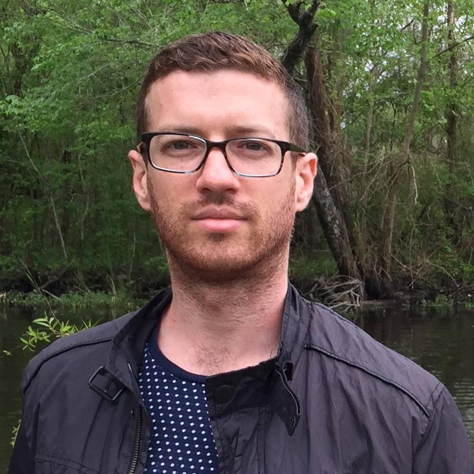 A portrait of a person outside.