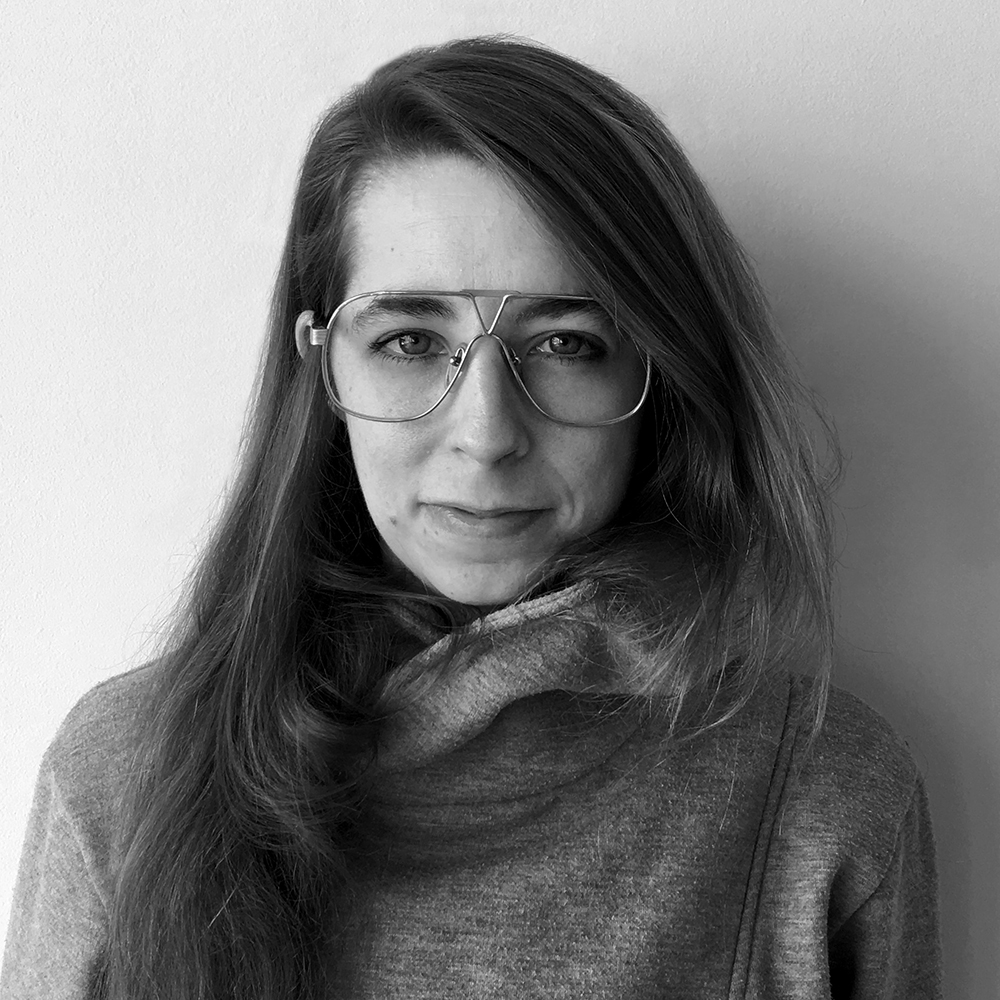 A portrait of a person against a light background.