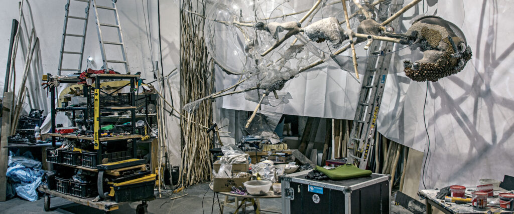 The interior of an art studio with sculpture materials.