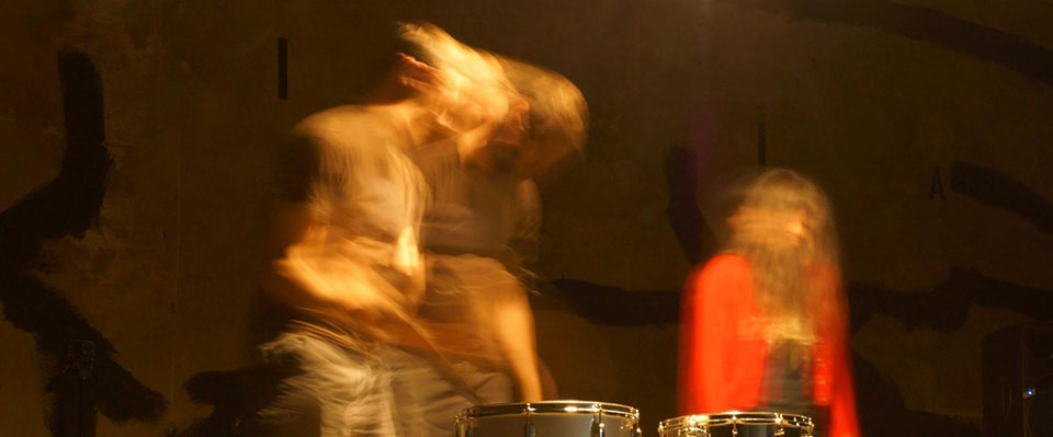 A photograph of two people blurred by their movement.