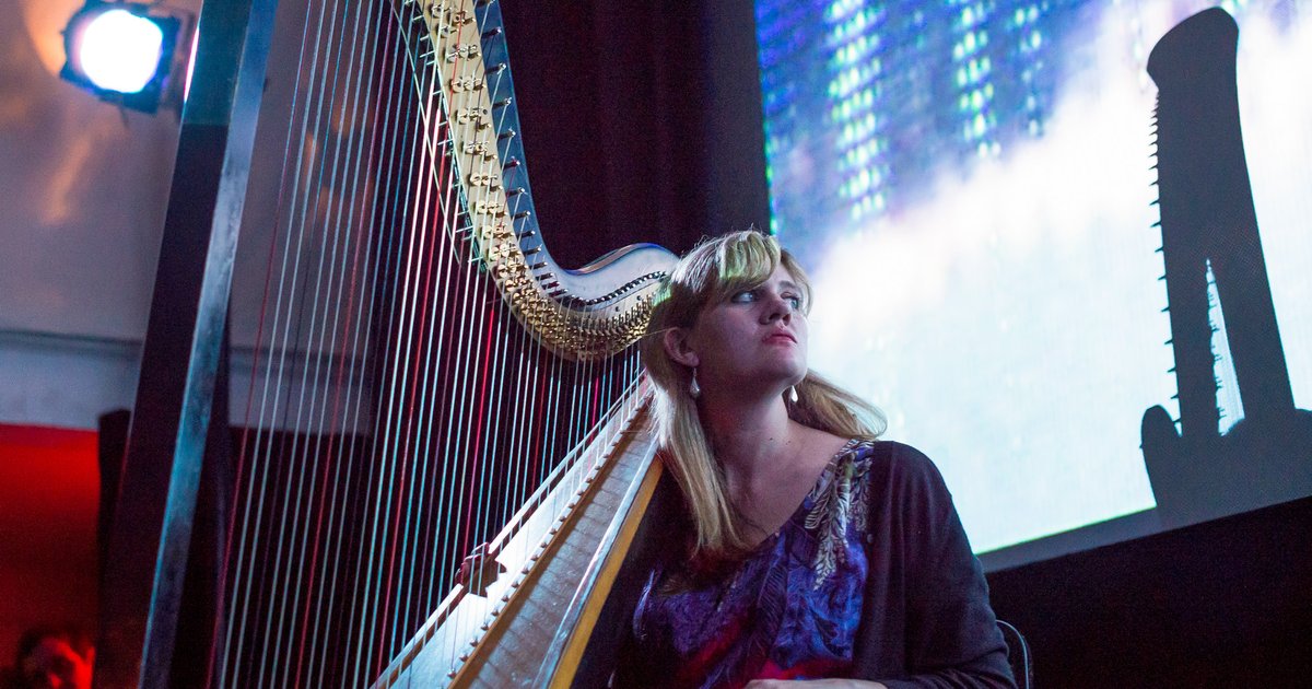 A person with a harp.