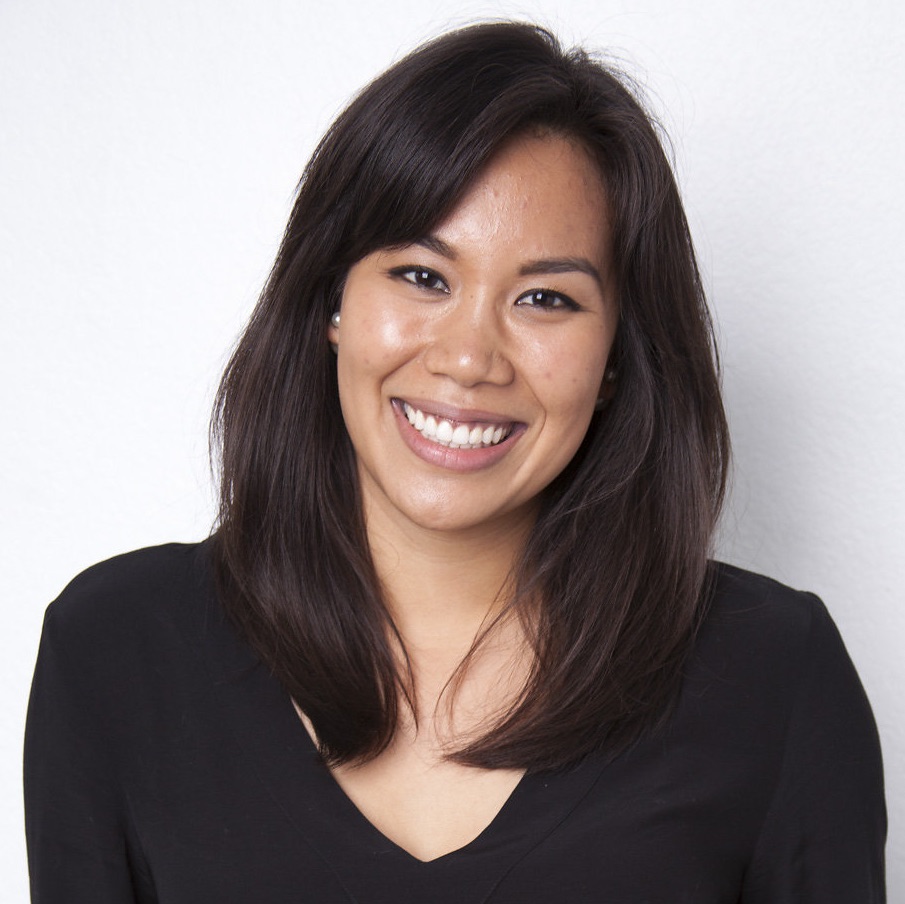 A portrait of a person against a light background.