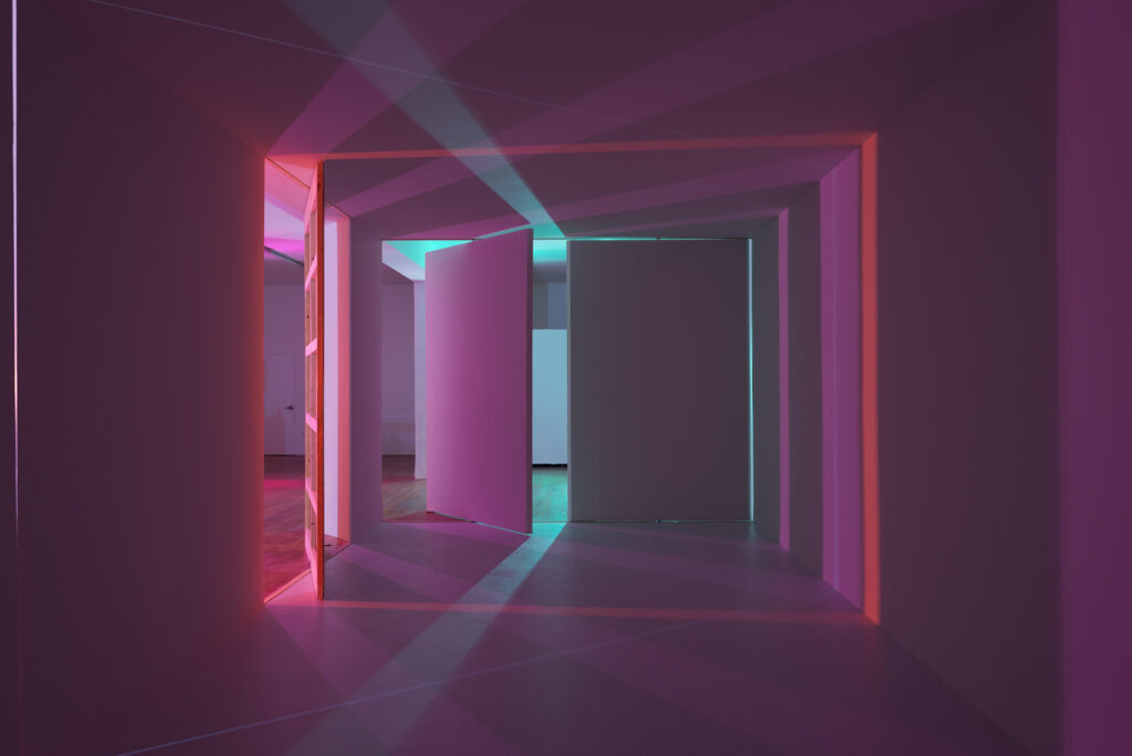A room lit by various colored lights.