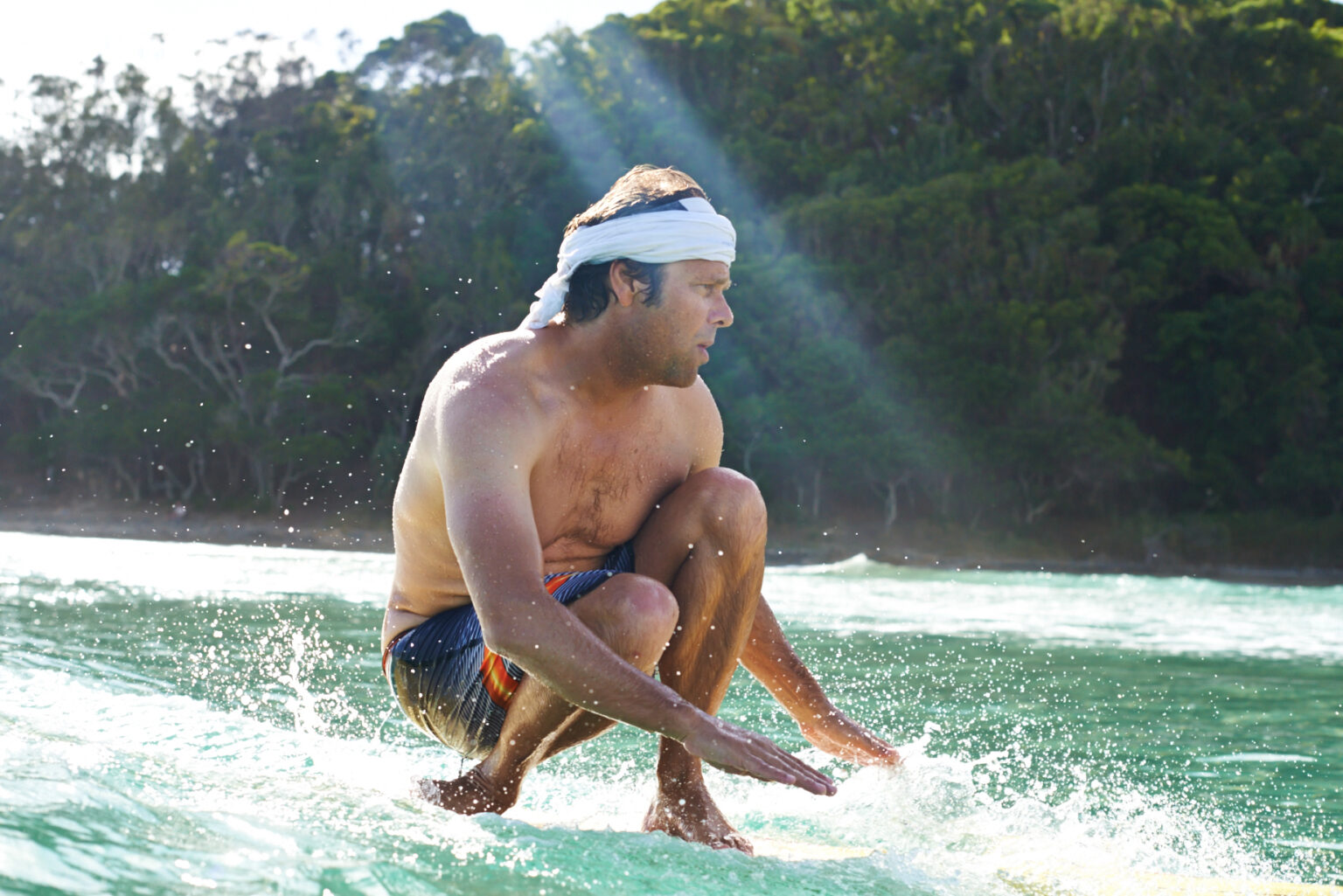 A person surfing in the ocean.