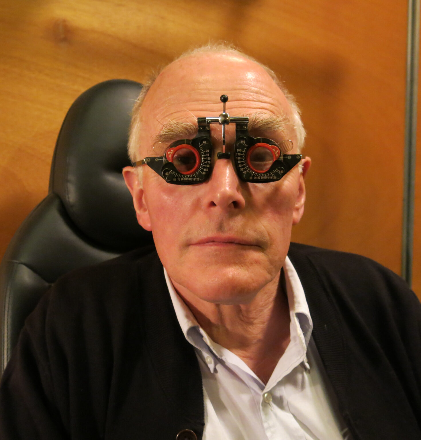 A portrait of a person wearing a phoropter.