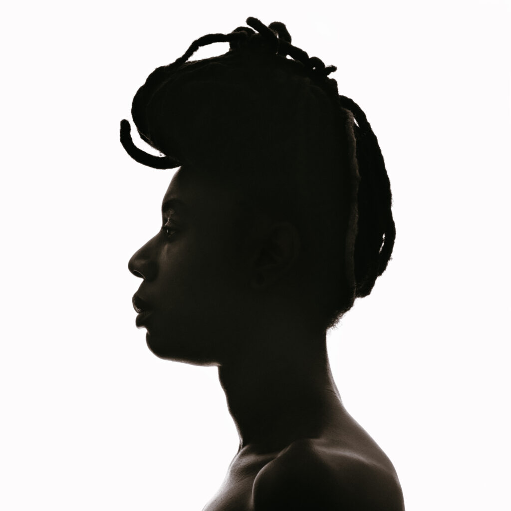 A photo of a person's profile in silhouette