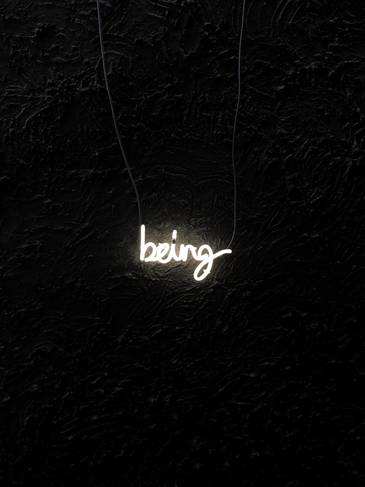 A white neon sign that says
