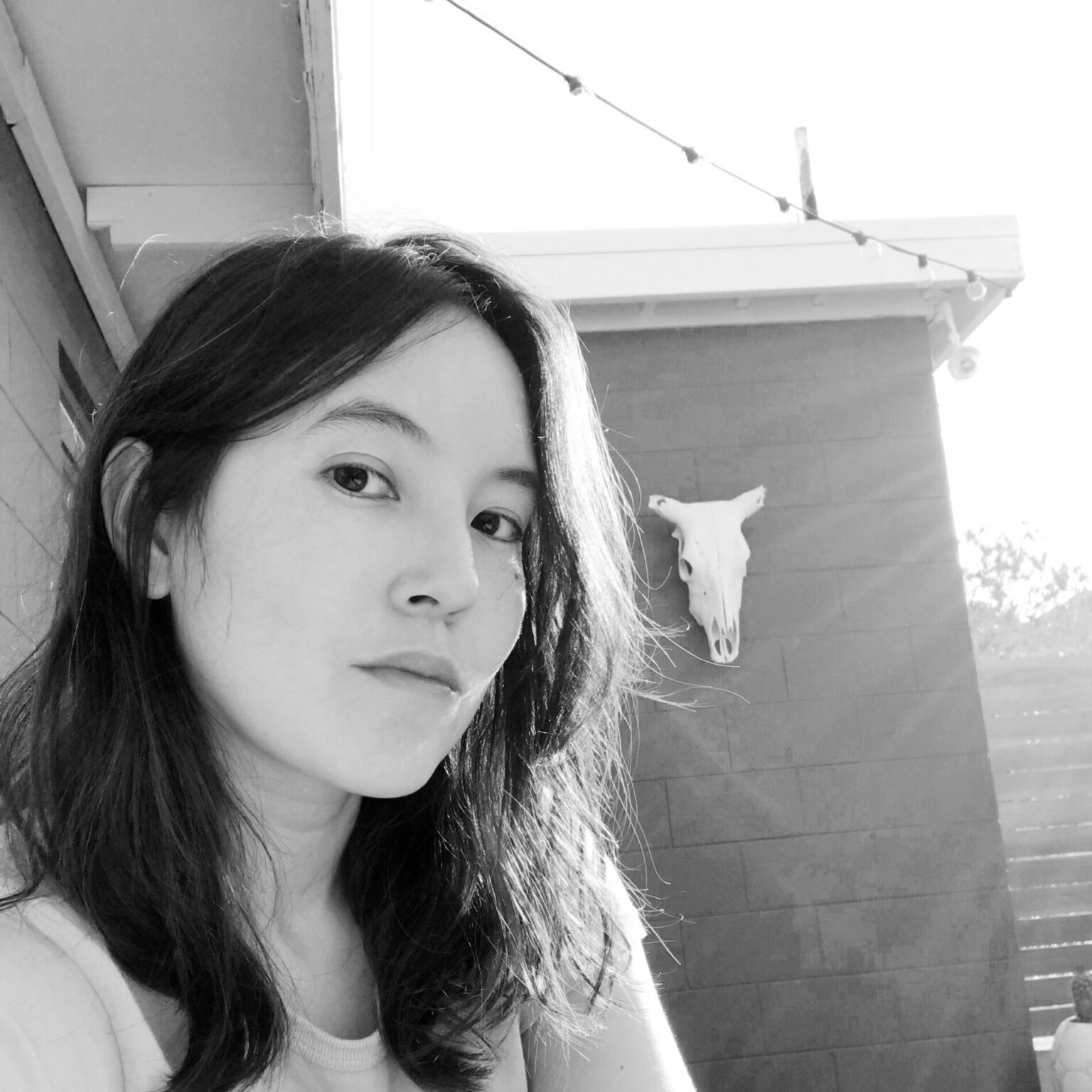 A portrait of a person outside.
