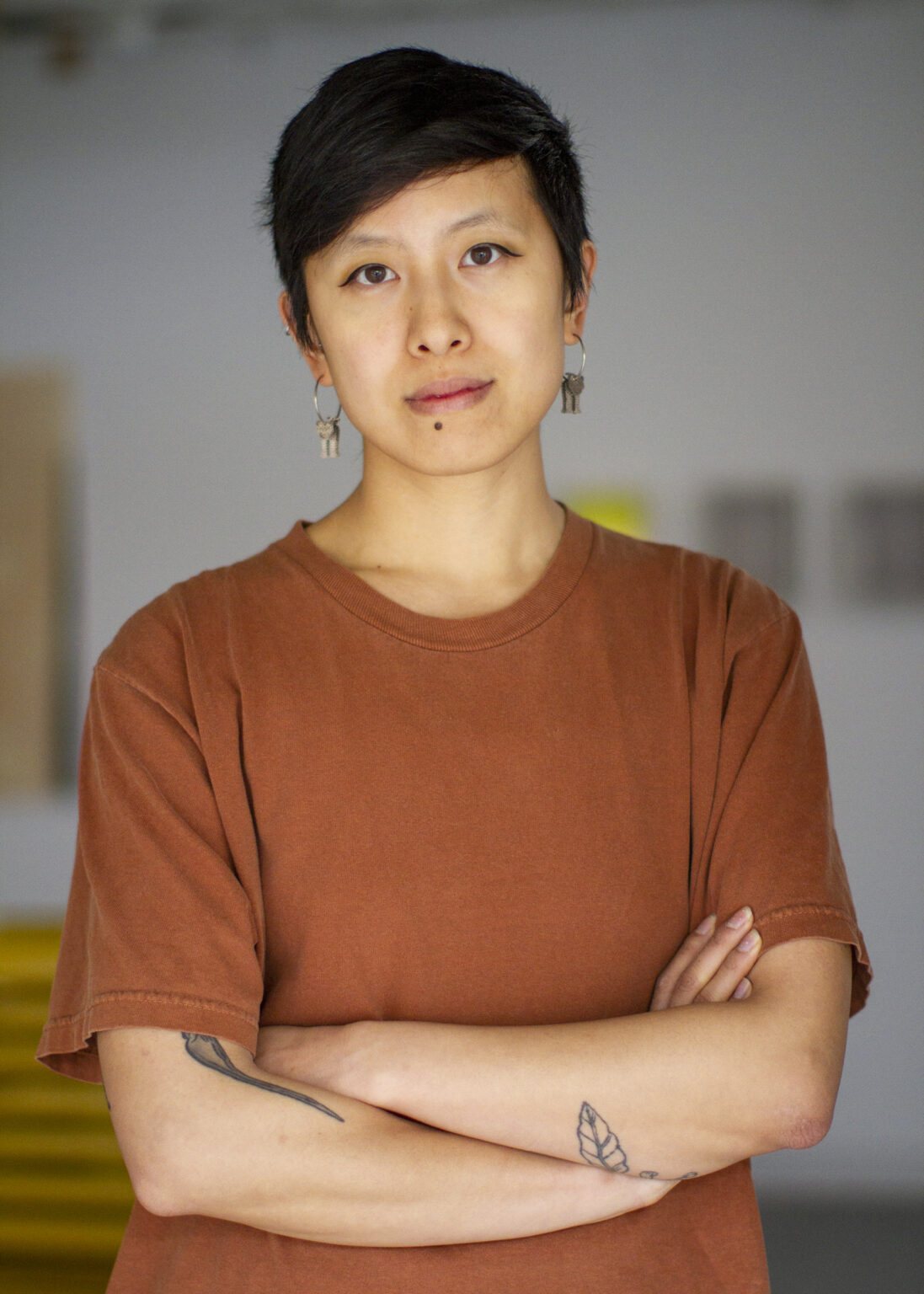 A portrait of a person in a gallery.