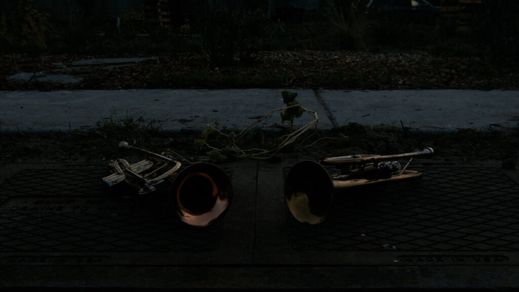 brass trumpets on the ground in the dark