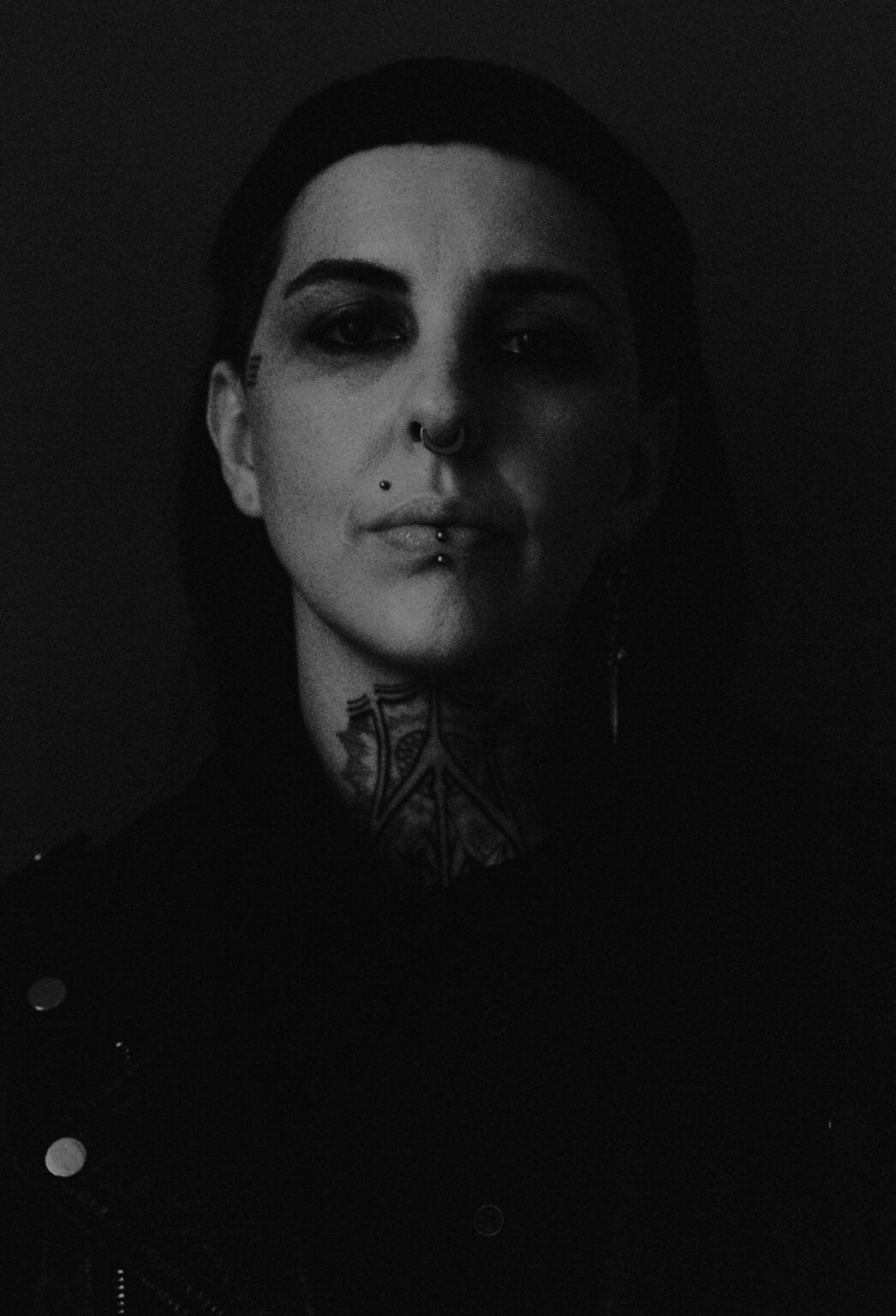 A shadowy portrait of a person.