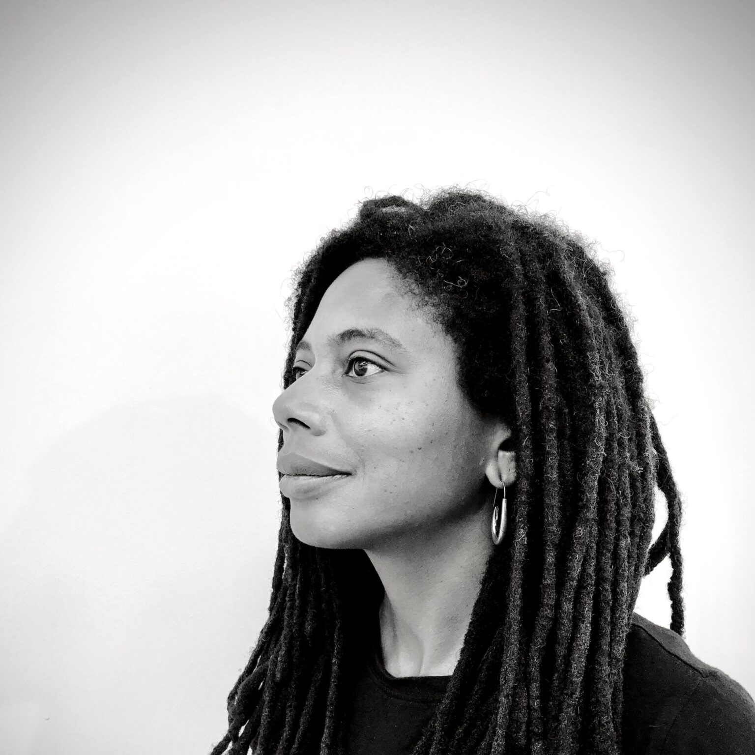 A portrait of a person against a light background.