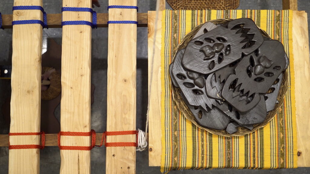 Top view of table with carved objects on tray.