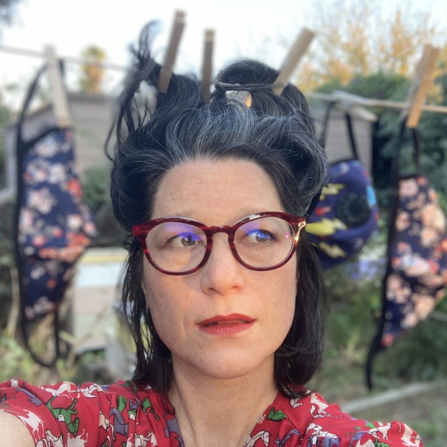 Person standing in front of clothesline.