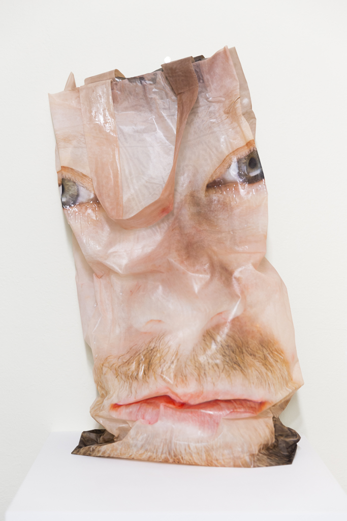 crumpled fabric form printed with a face