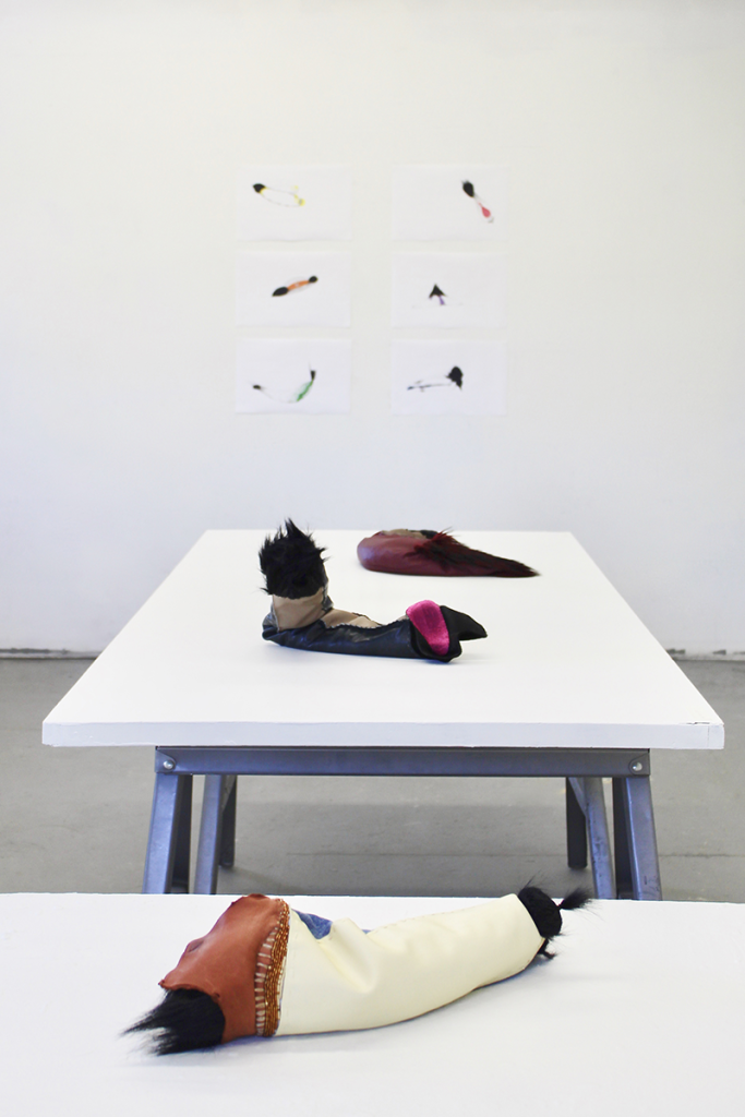 artist-made objects on a white table