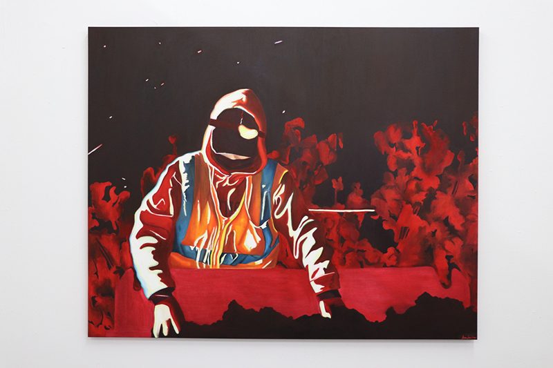 Painting in hues of orange and red on black of a figure in a sweatshirt and reflective vest among plants.
