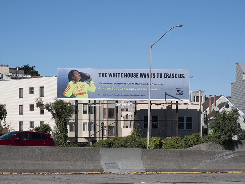 Billboard with an images of a person wearing a shirt with text reading 
