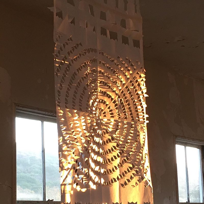 Intricate paper cut out in a radiating geometric pattern