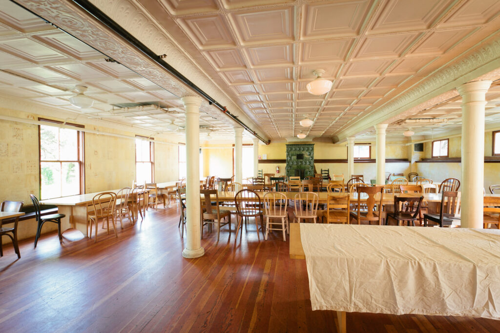 A large mess hall set with table