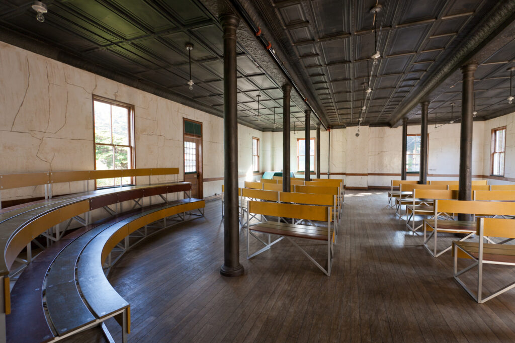 A large room with curving benches