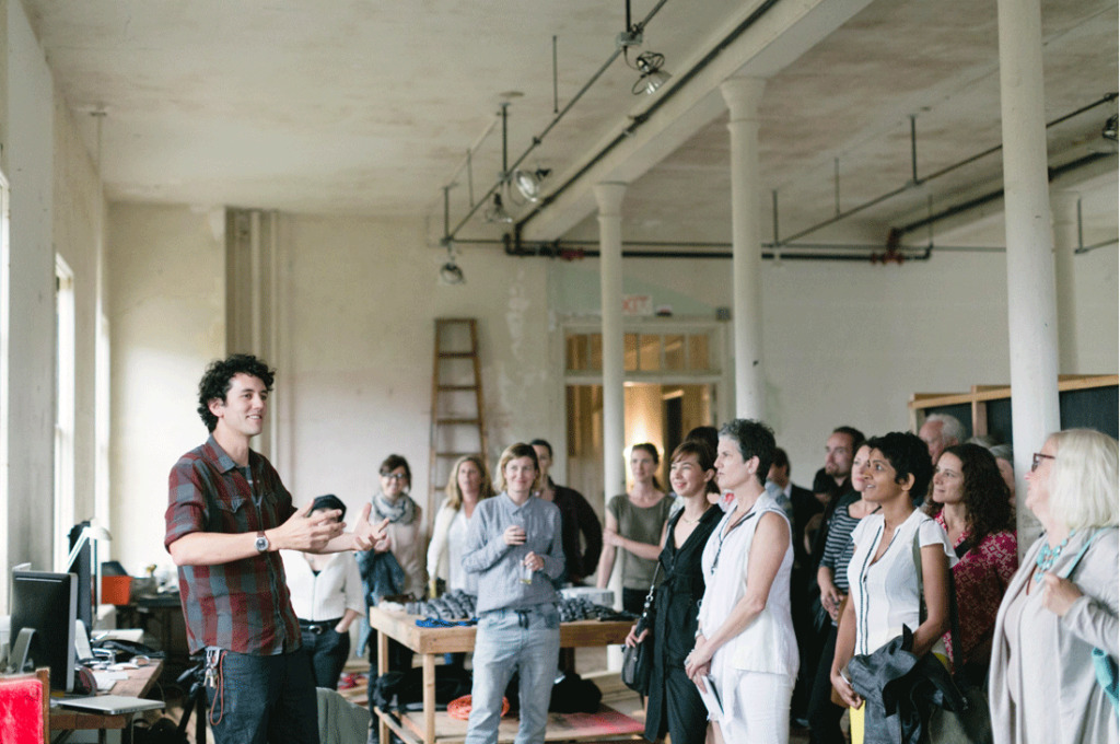 A person talking to a group of people