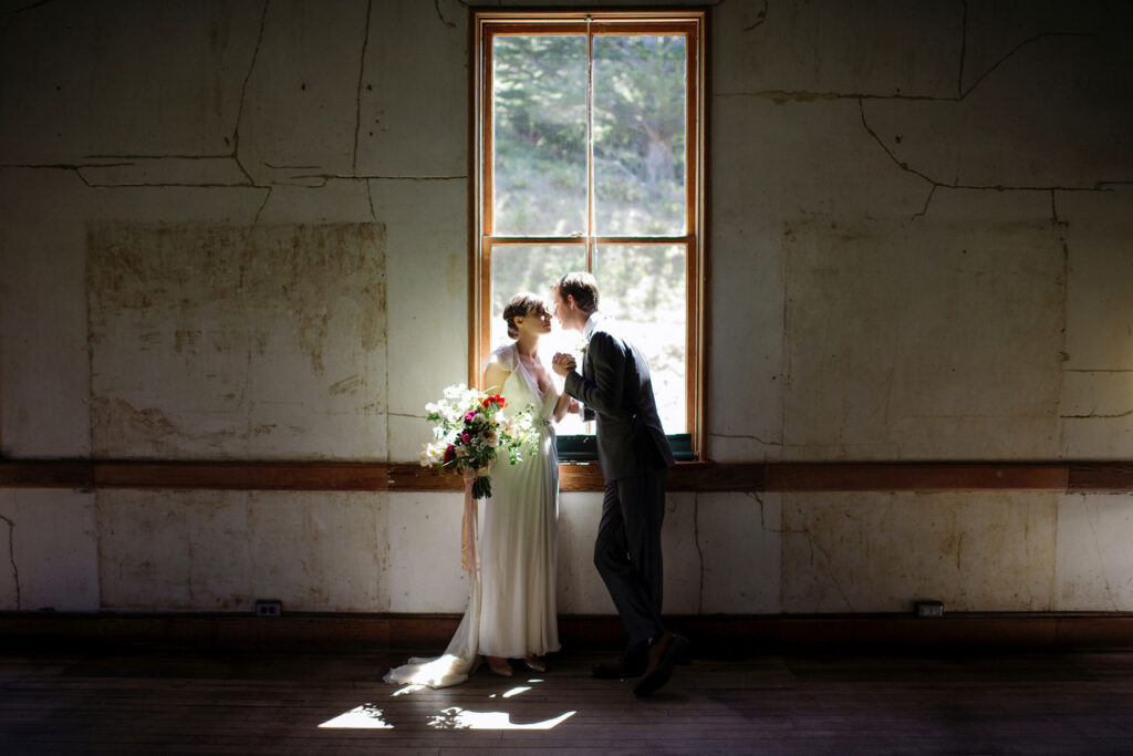 A couple by a window