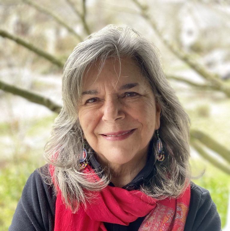 portrait of a person w a red scarf