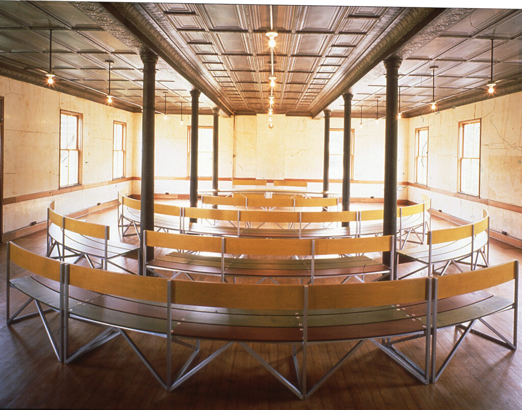 A large room with curving benches