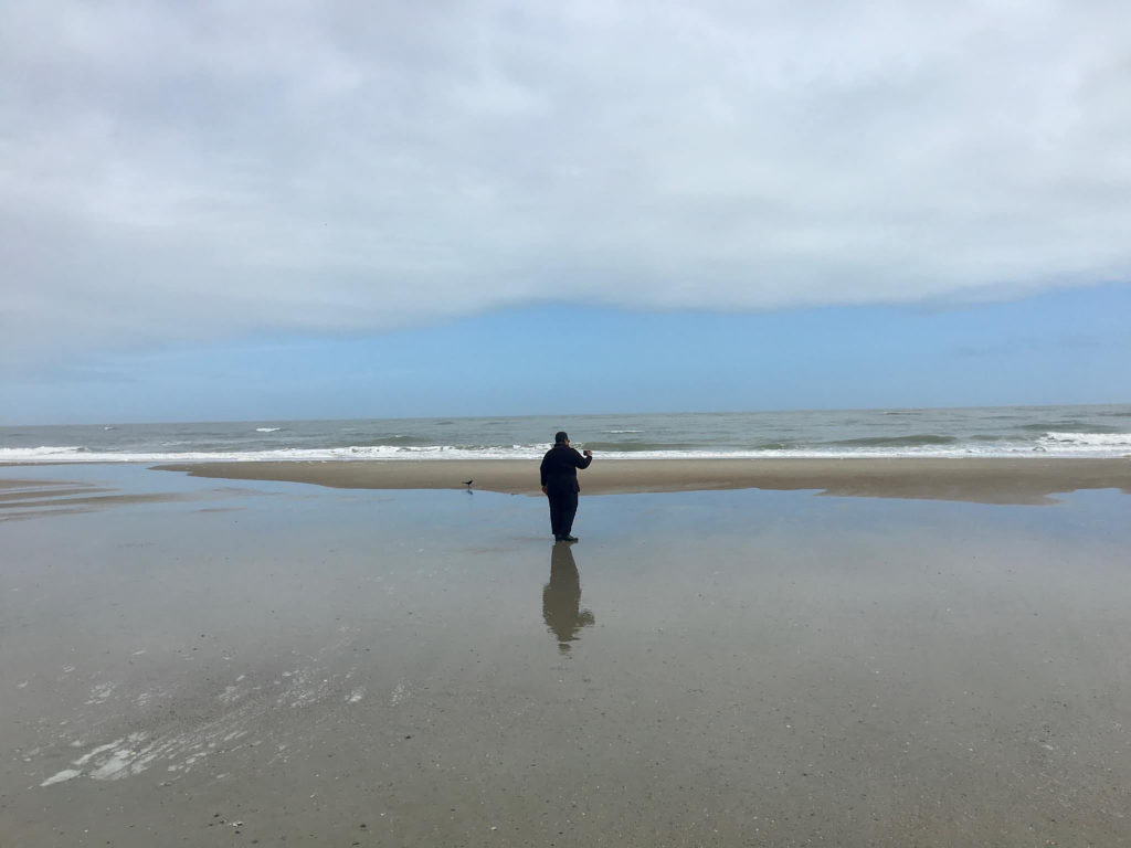 person on a large wide beach