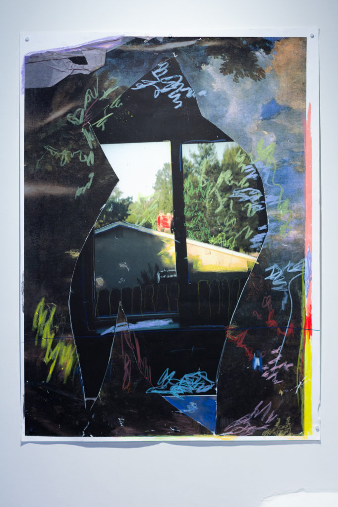 Photo collage of a broken window with scribbled marks and colors