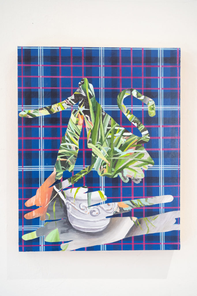 A painting of a plant in front of a plaid pattern