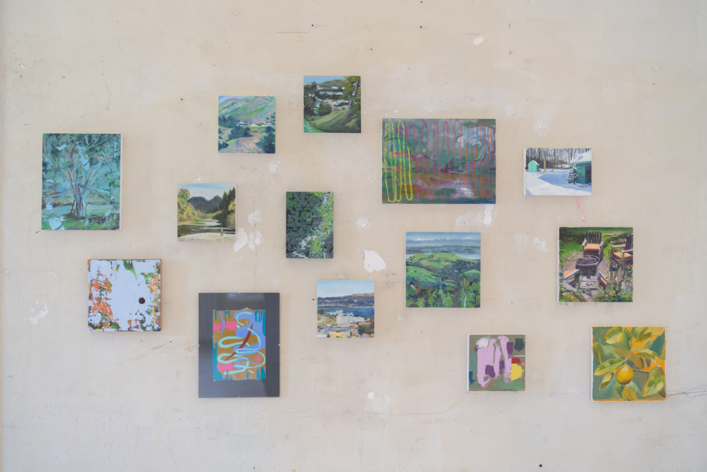 Various small paintings on a wall