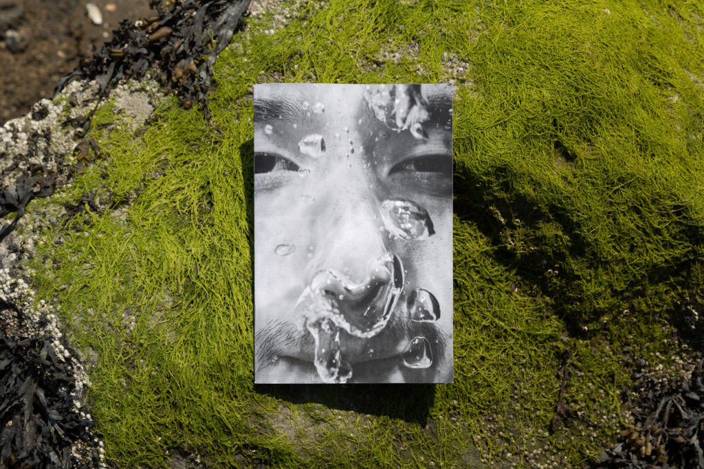 Photo of a photo of a person underwater