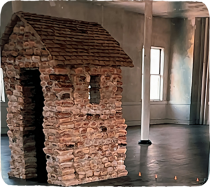 A sculpture of a house made of bread