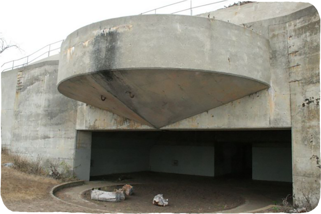 A large concrete bunker set into a hill