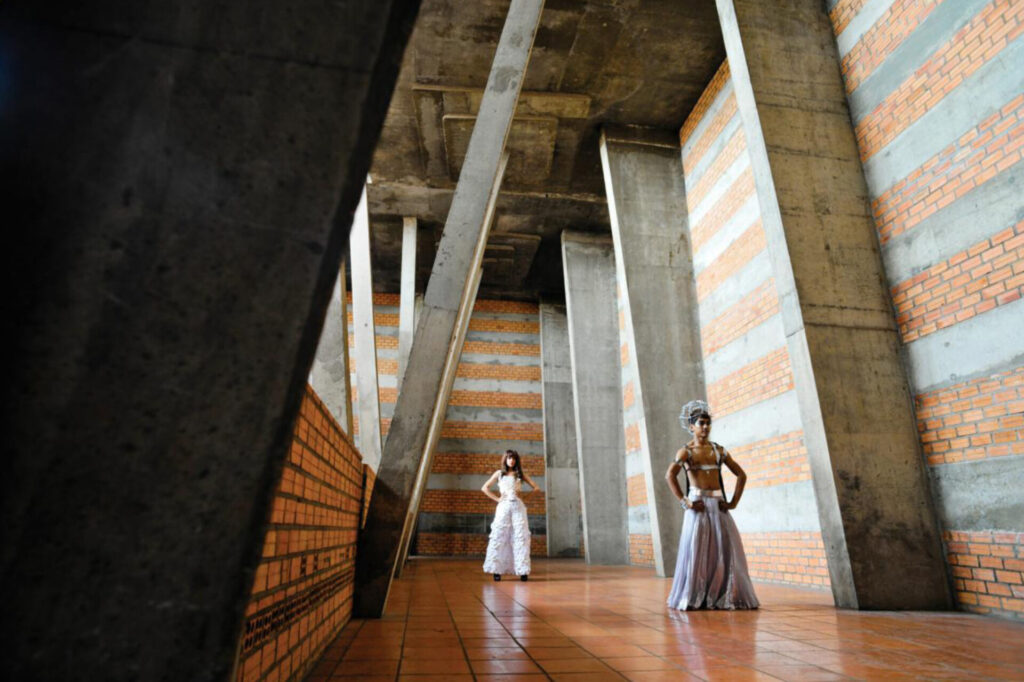 People in an ornate hallway