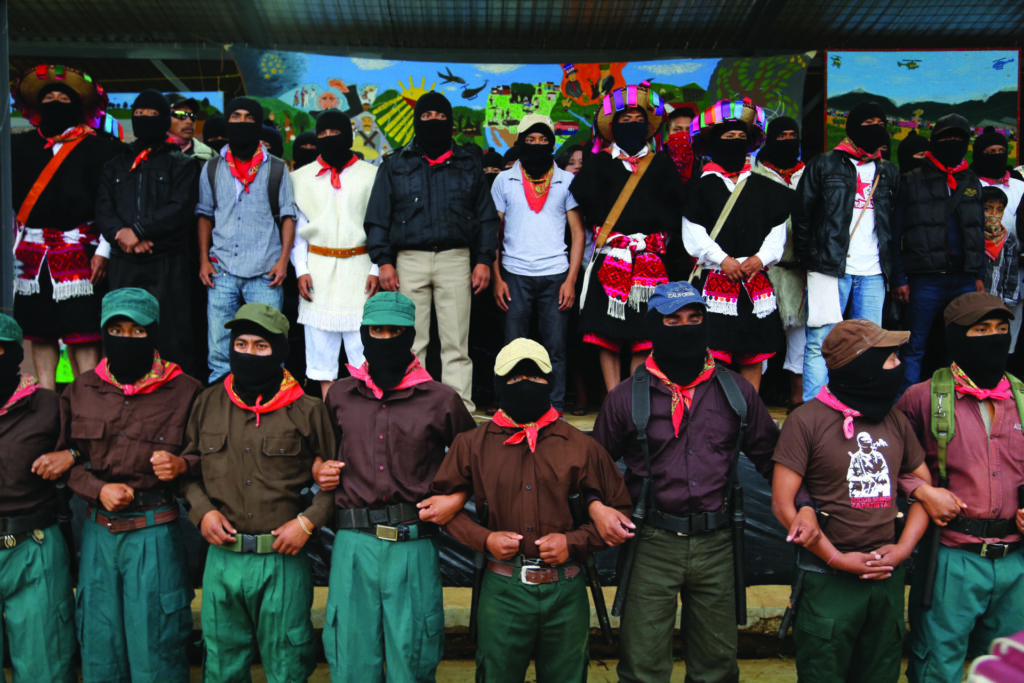 A group of people wearing black face coverings