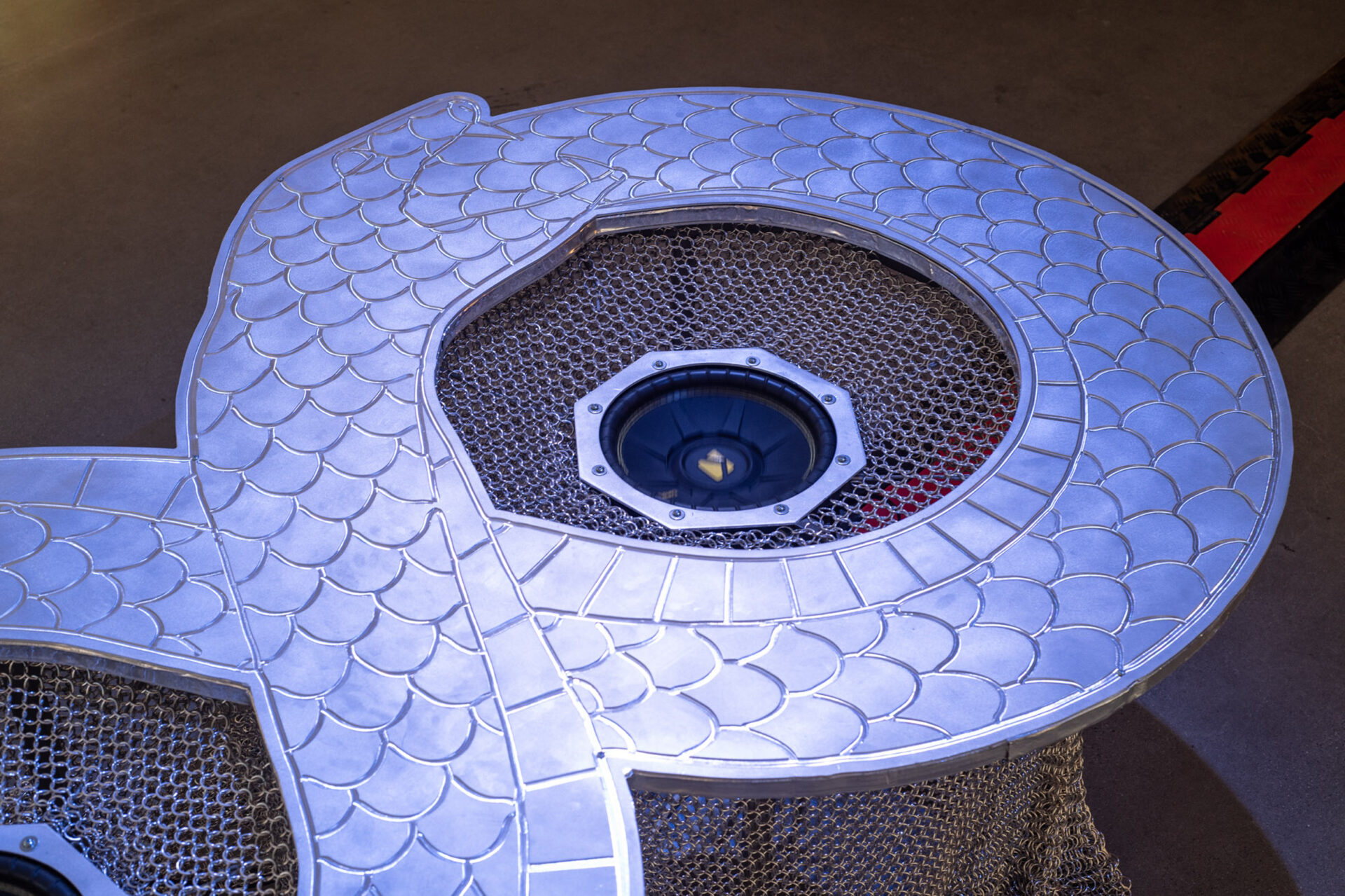 A metal structure engraved with a snake eating its own tail