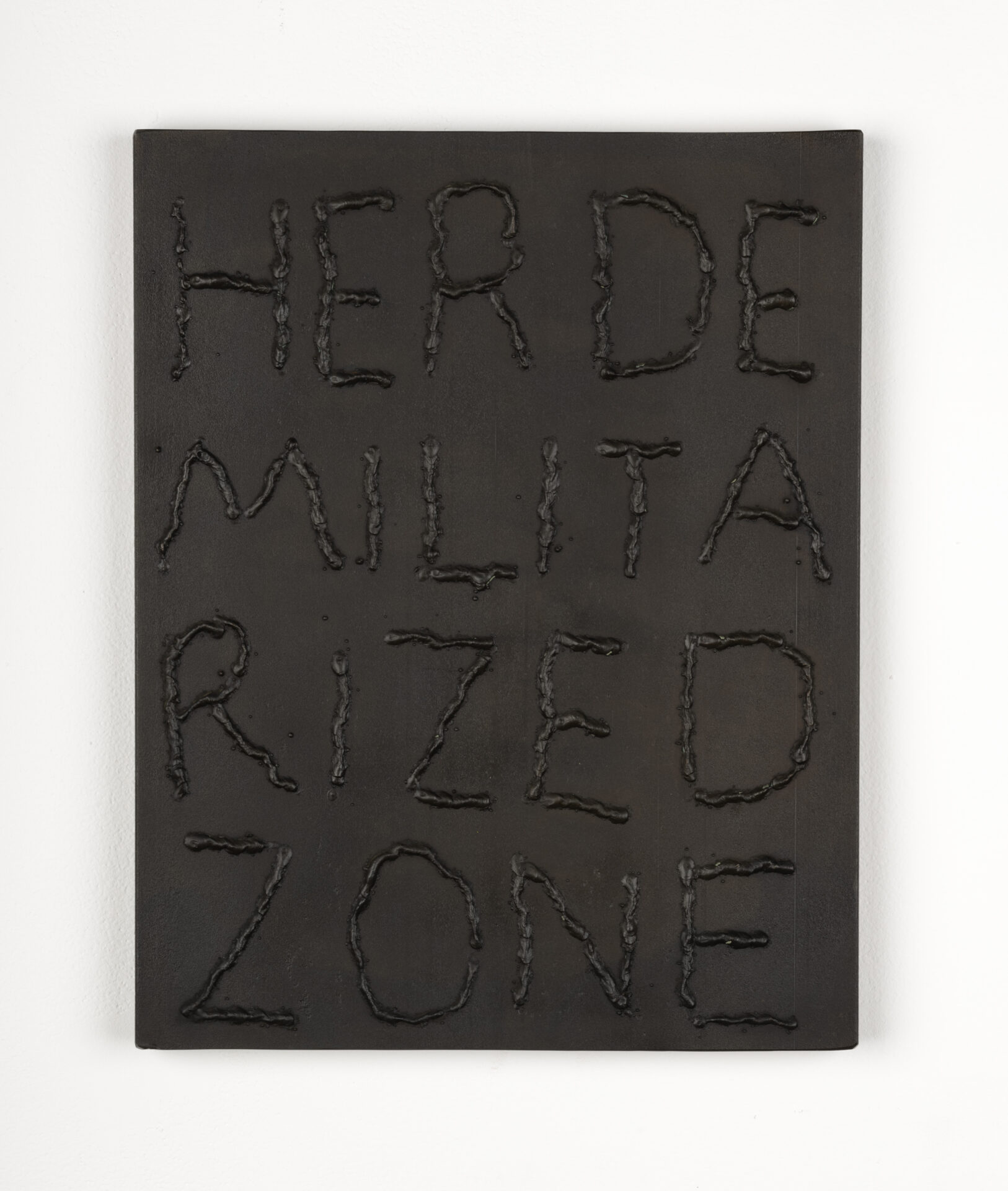 Steel rectangle with text that reads