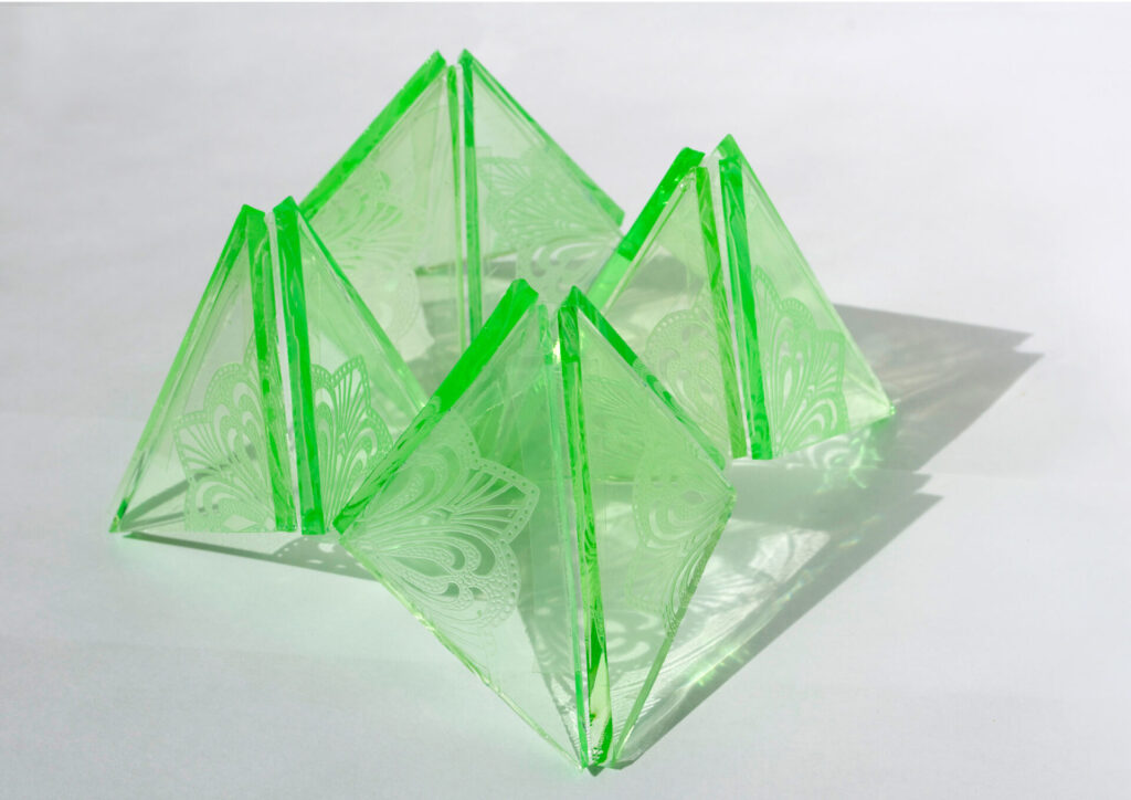 Four connected pyramids of green glass