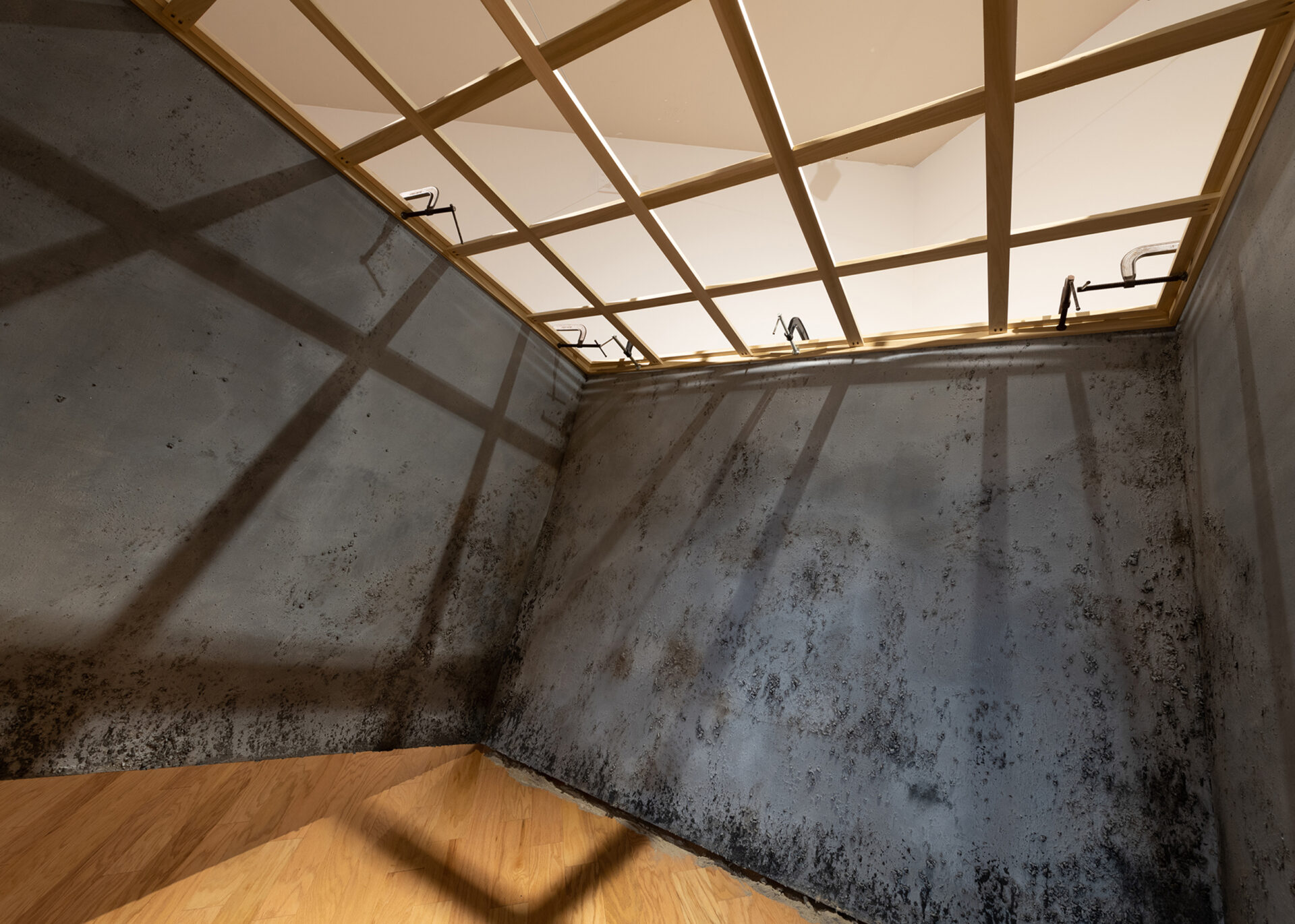 Grey panels forming three walls