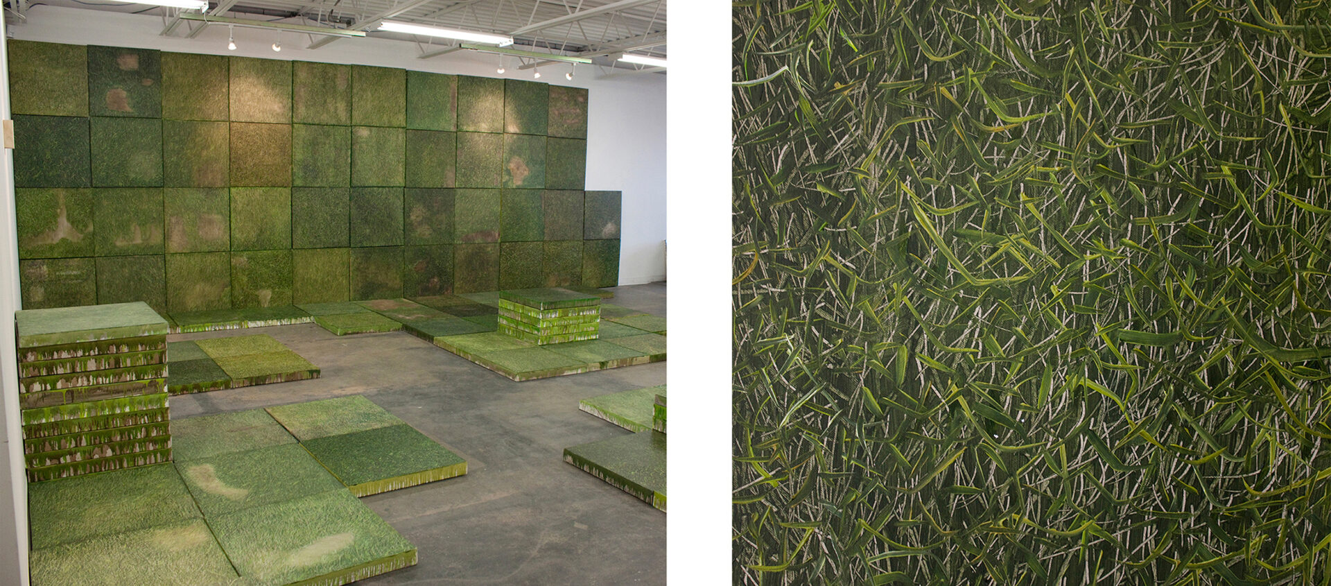 Many square paintings of grass whung on a wall and set on the floor, and stacked in a pile