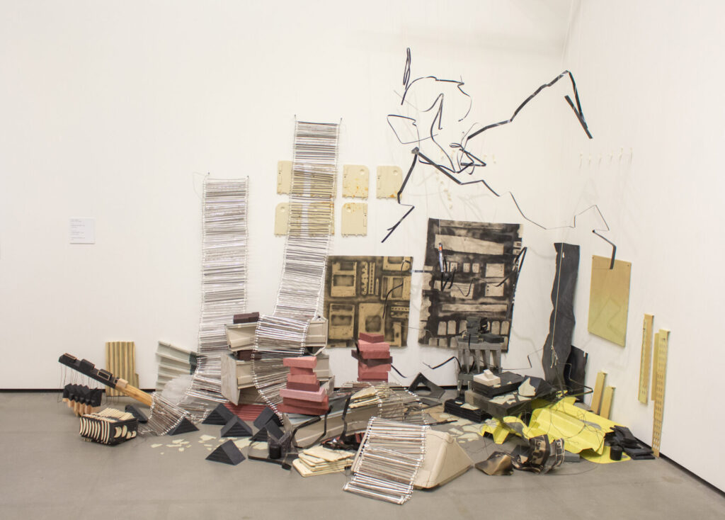 An arrangement of objects on the floor and wall