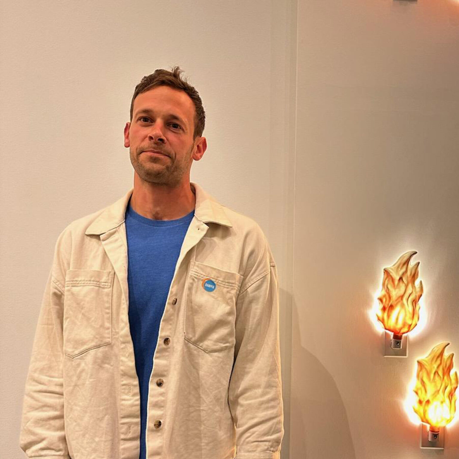 Portrait of Samuel Wildman with plugin lights that look like little fires