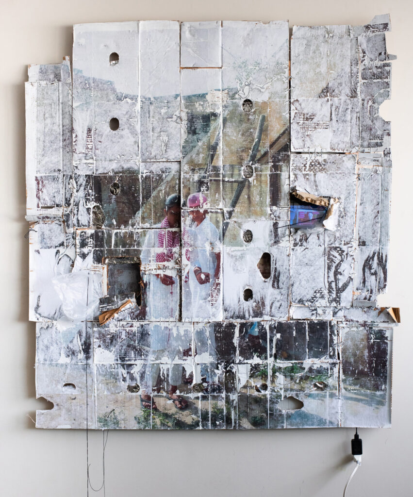 A collage of images and white cardboard